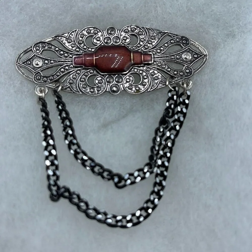 Vintage Victorian looking enamel dropping chains brooch.